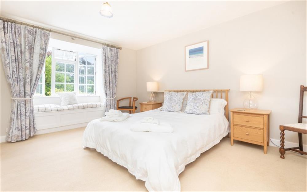 Stylish master bedroom at Mews Cottage in Newton Ferrers