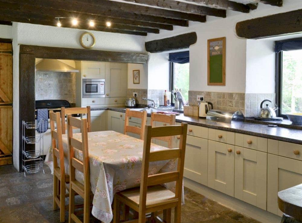Open plan living/dining room/kitchen (photo 5) at Mews Cottage in Penrith, Cumbria