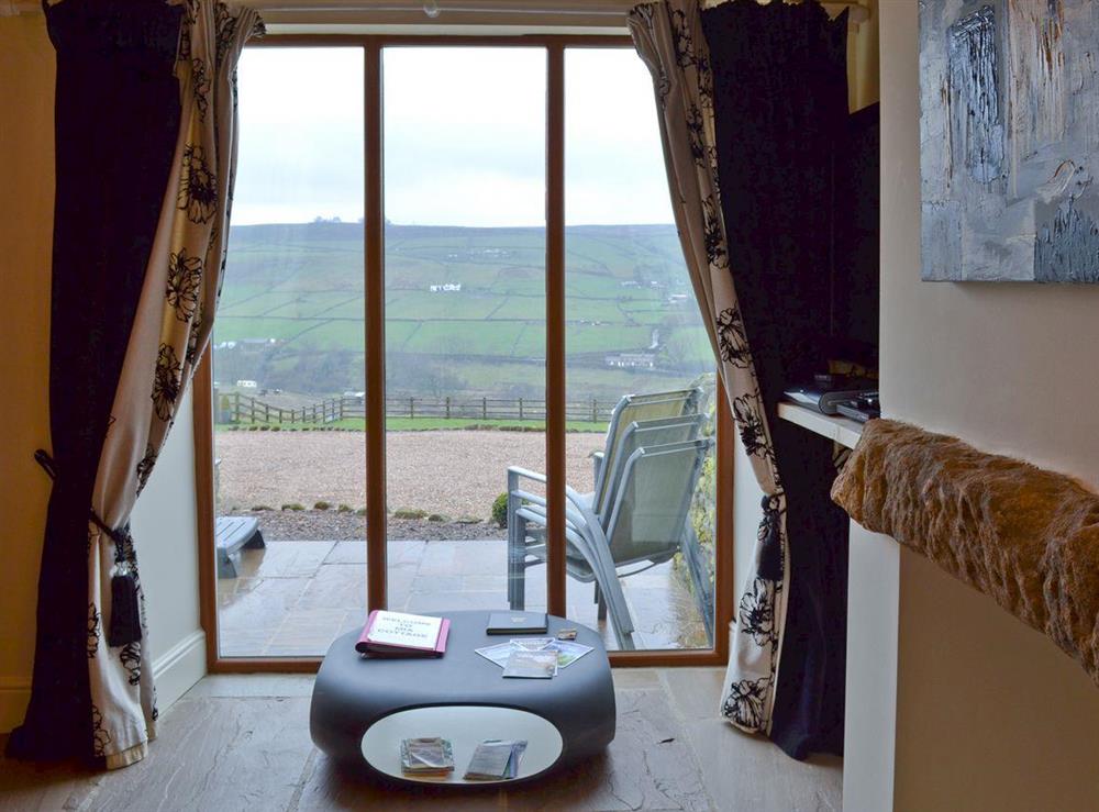 Floor to ceiling window with stunning views at Mia Cottage in Buckley Green, near Haworth, Yorkshire, West Yorkshire