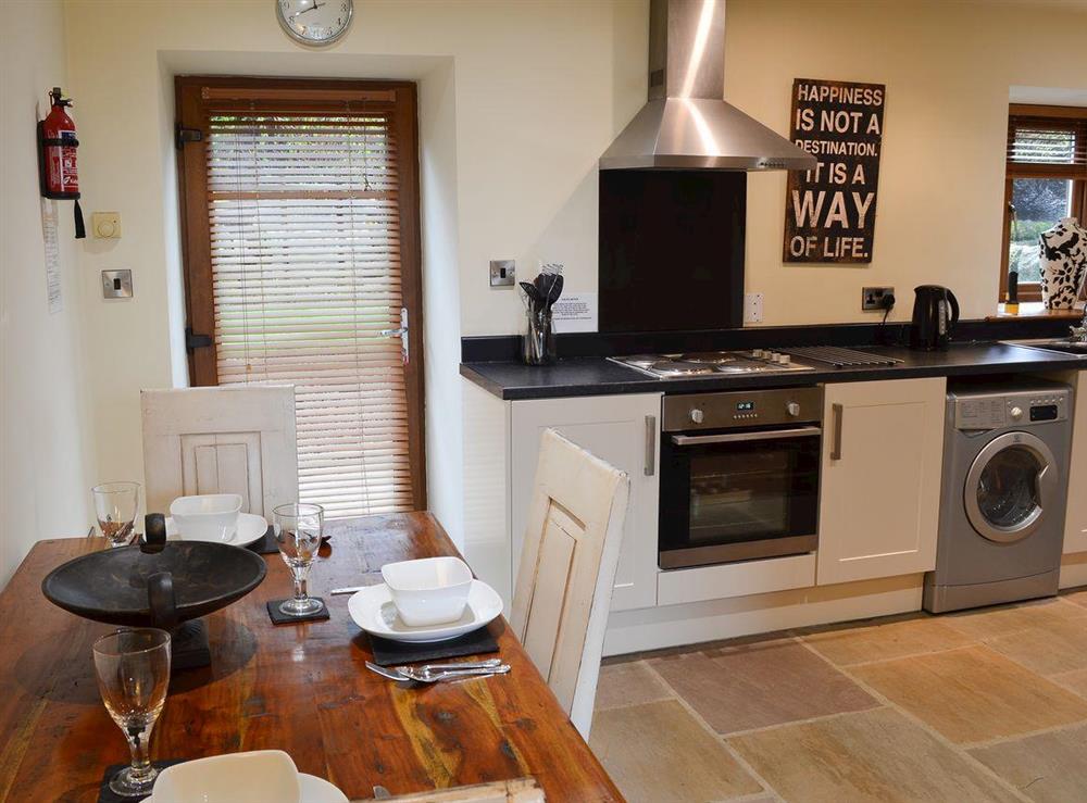 Kitchen with dining area at Mia Cottage in Buckley Green, near Haworth, Yorkshire, West Yorkshire