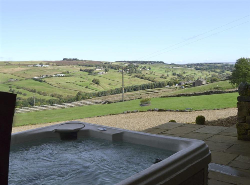 Savour the magnificent scenery from the relaxing luxury hot tub at Mia Cottage in Buckley Green, near Haworth, Yorkshire, West Yorkshire