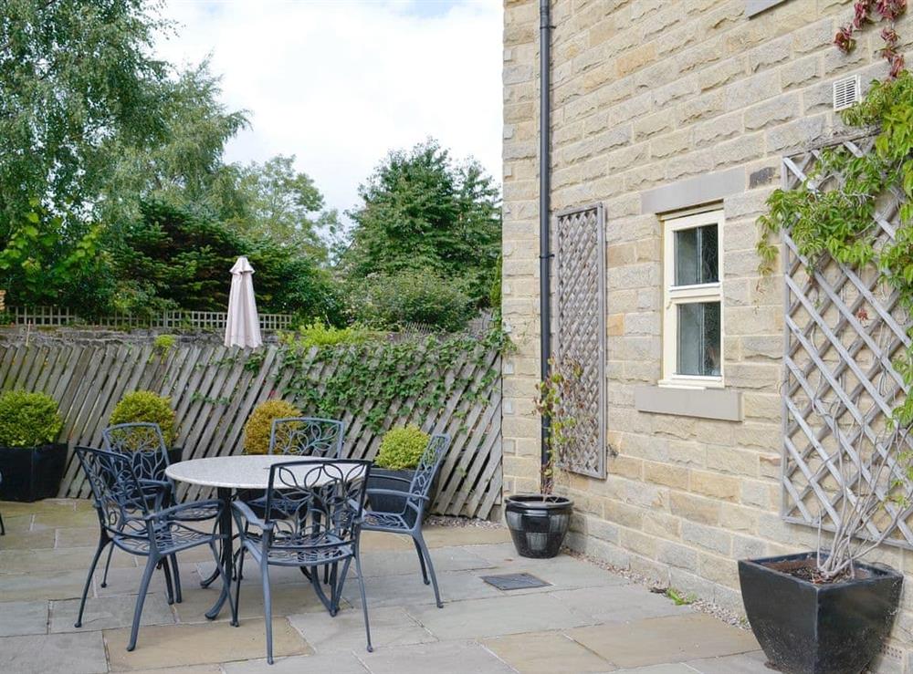 Paved patio area with outdoor furniture at Mickle Hill Mews in Gargrave, near Skipton, North Yorkshire