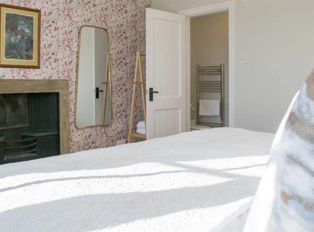 Characterful master bedroom with ideal en-suite shower room at Micklethorn in Broughton, near Skipton, North Yorkshire