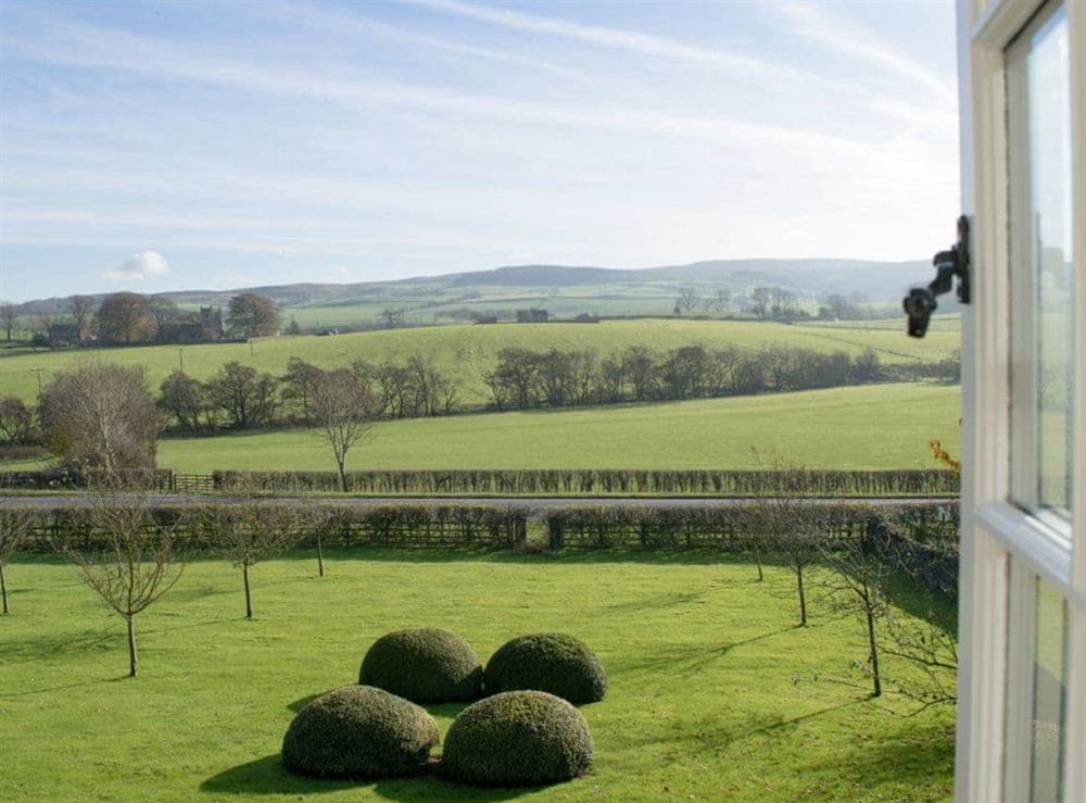 Stunning views over the garden and towards the surrounding countryside, from the bedroom at Micklethorn in Broughton, near Skipton, North Yorkshire