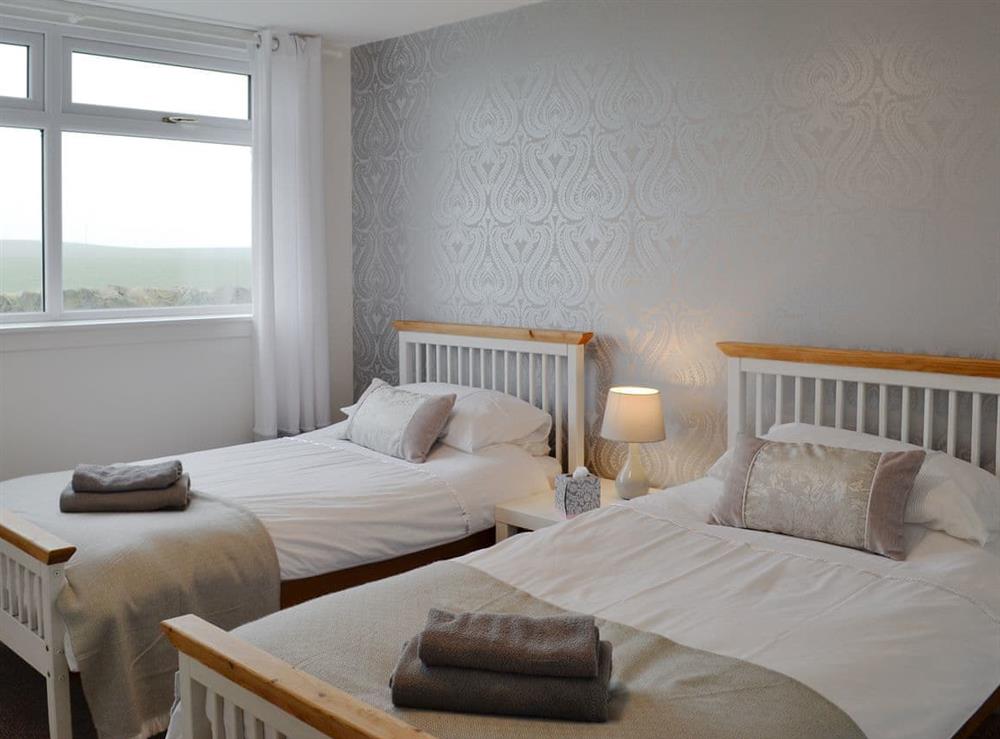 Comfy twin bedroom at Cotters Cottage, 