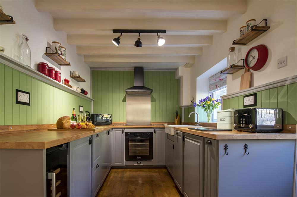 The well-equipped cottage kitchen with modern appliances at Middehus, Leyburn, North Yorkshire