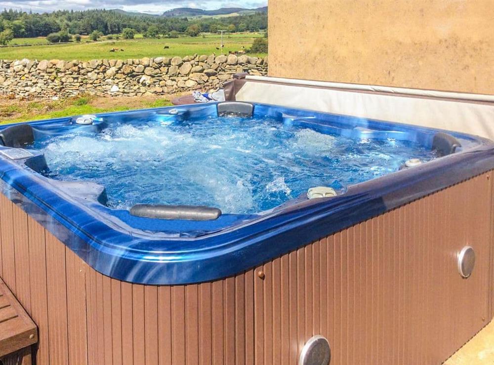 Relaxing hot tub at Middle Byre in Castle Douglas, Kirkcudbrightshire
