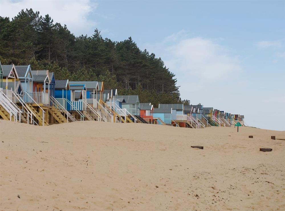 Cheerful nearby beach huts at Middle Cottage in Letheringsett, near Holt, Norfolk