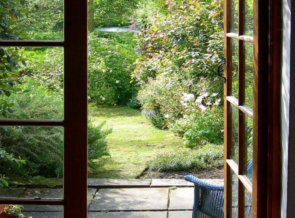 French doors from the summerhouse to the beautiful garden at Middle Cottage in Letheringsett, near Holt, Norfolk