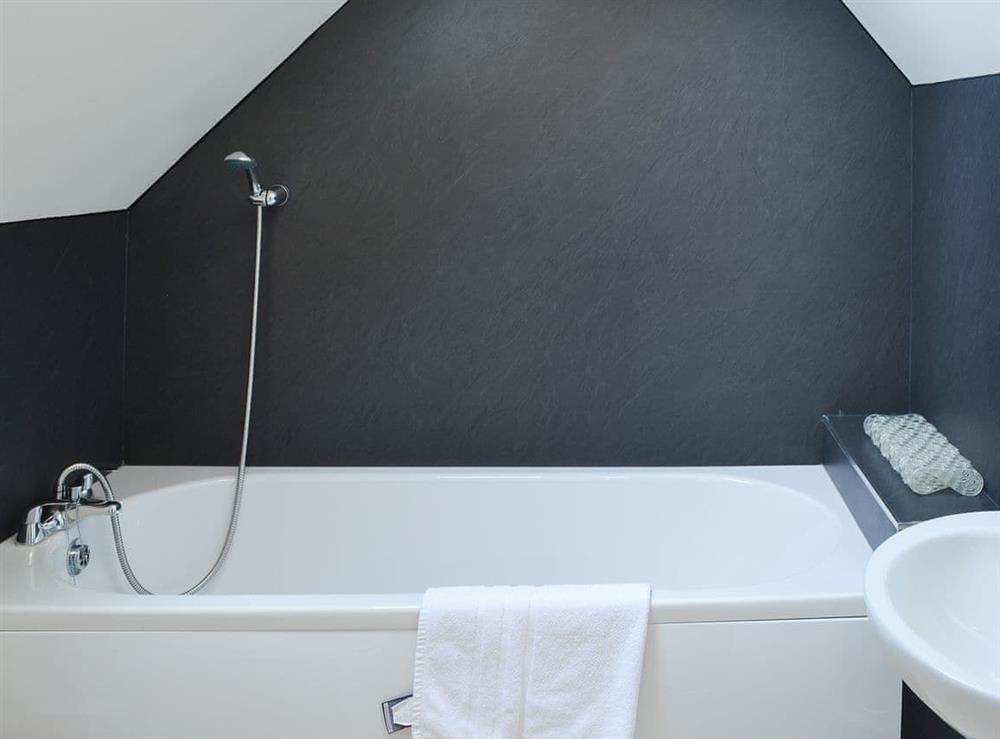 En-suite bathroom with shower attachment at Middle Cottage in Shilbottle, near Alnwick, Northumberland
