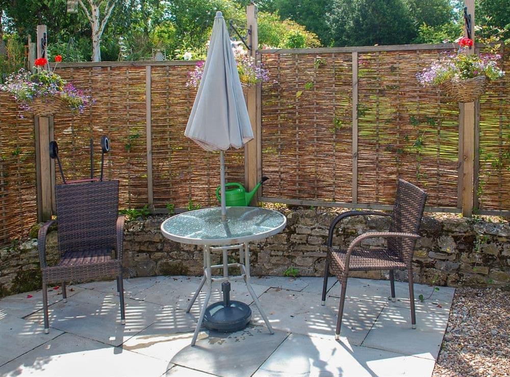 Paved patio with table and chairs at Middle Cottage in West Burton, near Leyburn, North Yorkshire