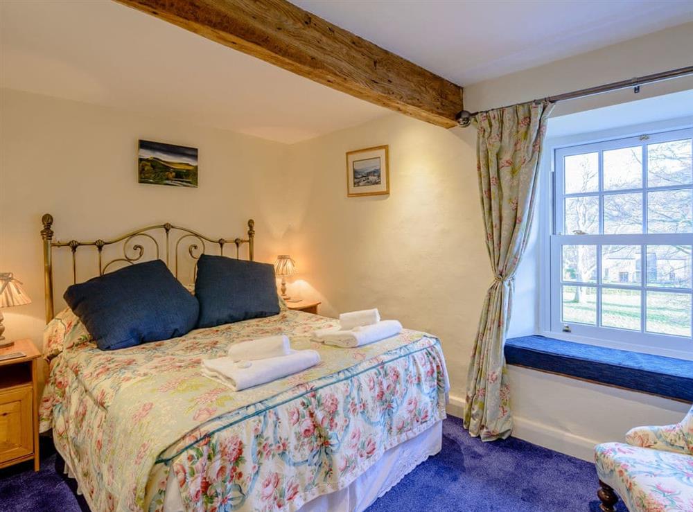 Welcoming bedroom with large bed at Middle Cottage in West Burton, near Leyburn, North Yorkshire