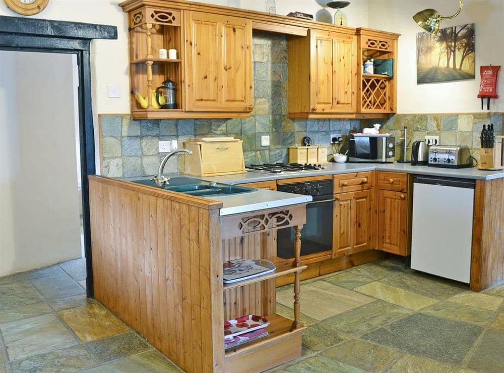 Well equipped kitchen area at The Carriage House, 