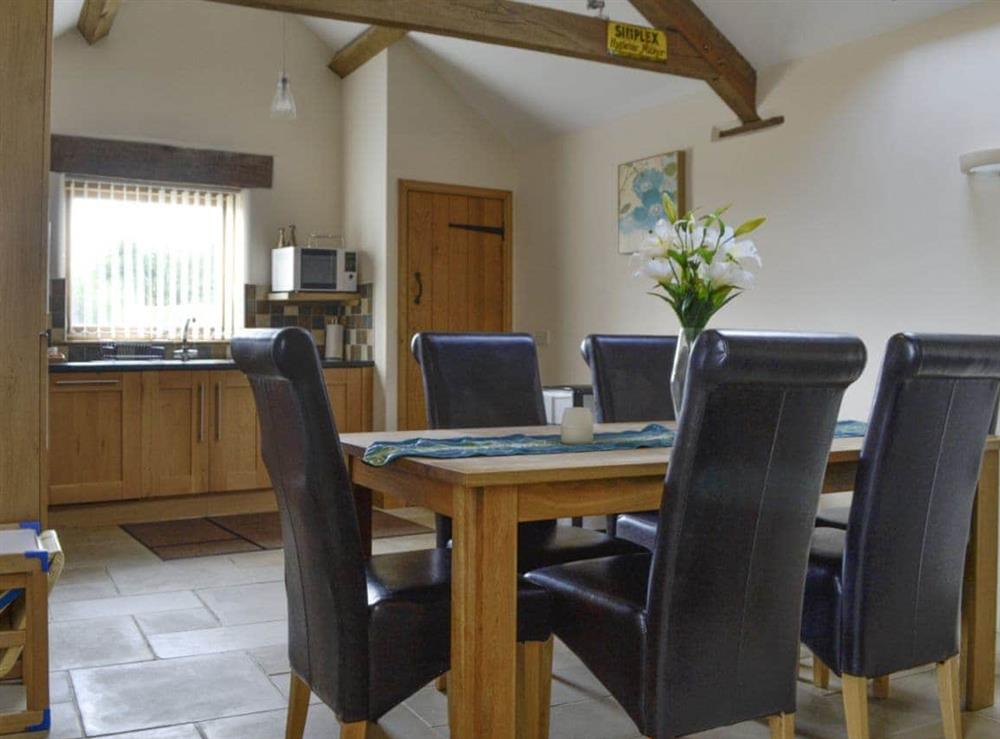 Dining area and kitchen at Bramble Barn, 