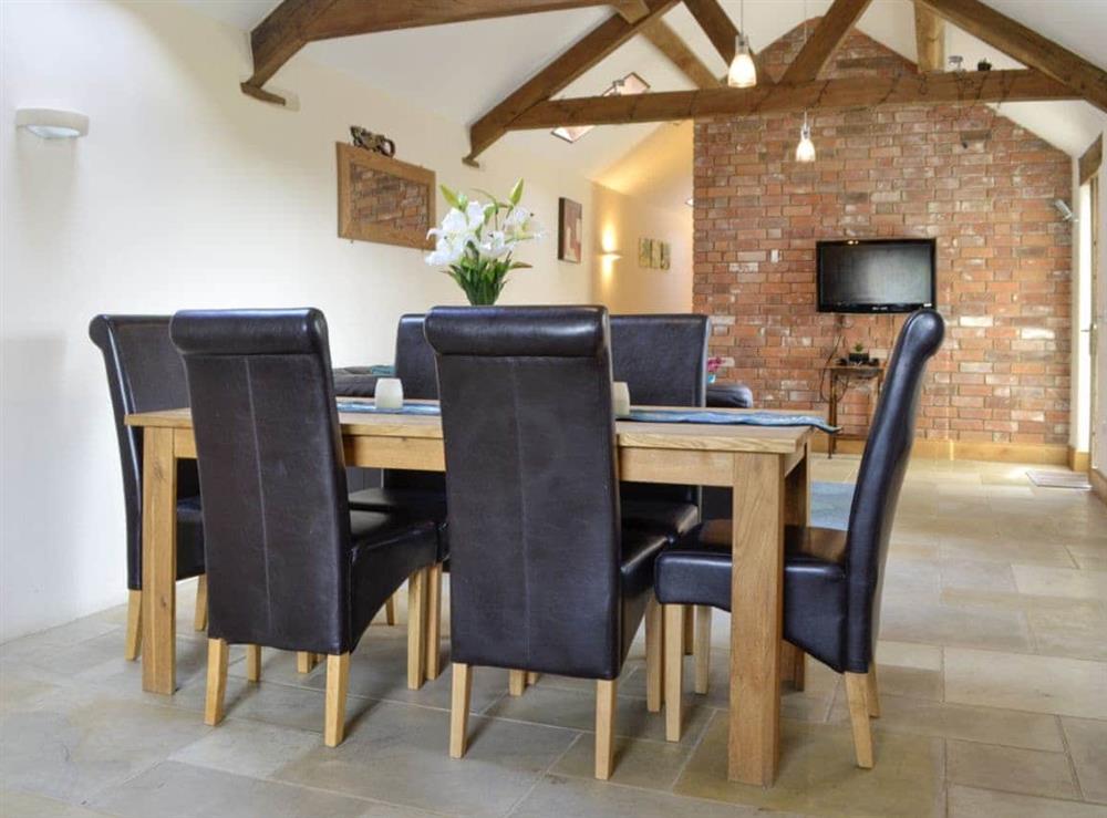 Dining area in open-plan living room at Bramble Barn, 