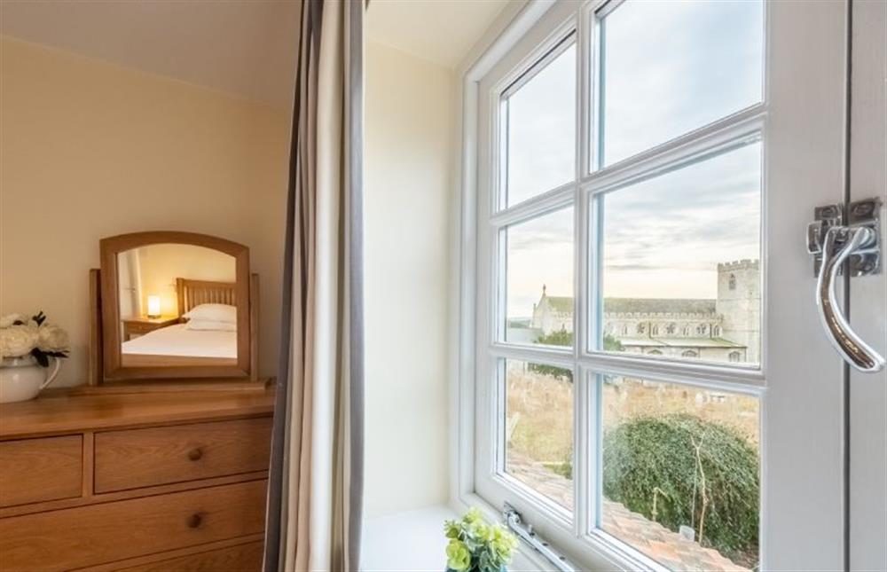 Middle Knoll: Master bedroom with a  view of Cley church  at Middle Knoll, Cley-next-the-Sea near Holt