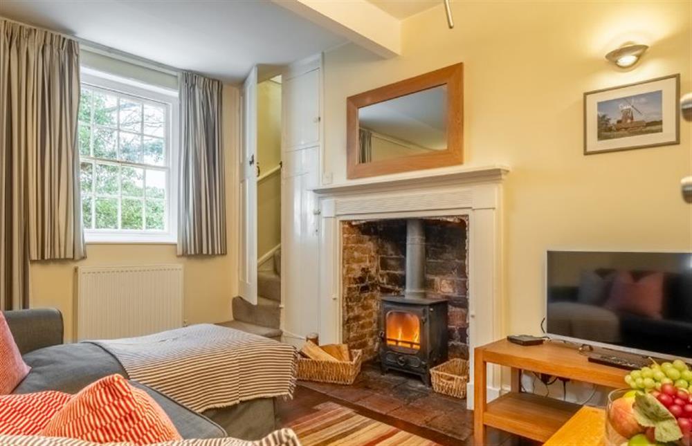 Middle Knoll: Sitting room featuring a log burner  at Middle Knoll, Cley-next-the-Sea near Holt