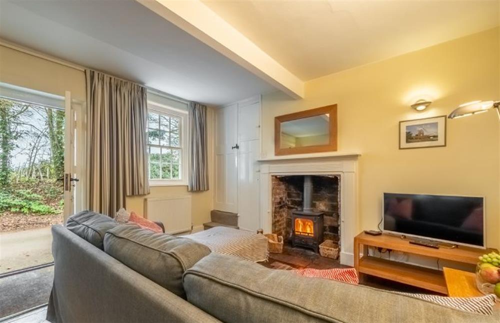 Middle Knoll: Sitting room with log burner, smart television and plenty of seating  at Middle Knoll, Cley-next-the-Sea near Holt