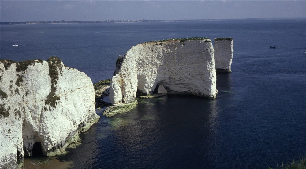 View of white chalk cliffs, arches and stacks of Old Harry Rocks near Studland, Dorset at Middlebere Farmhouse in Isle Of Purbeck, Dorset