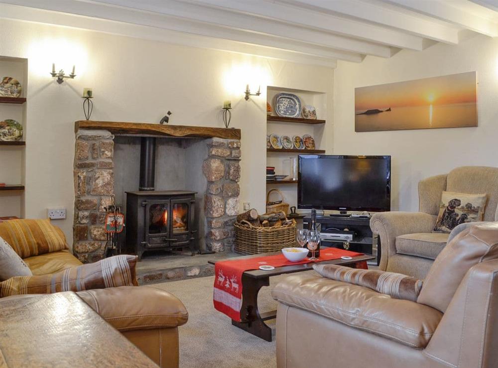 Characterful living room with wood burner at Middleton Hall in Rhossilli, near Swansea, Glamorgan, West Glamorgan