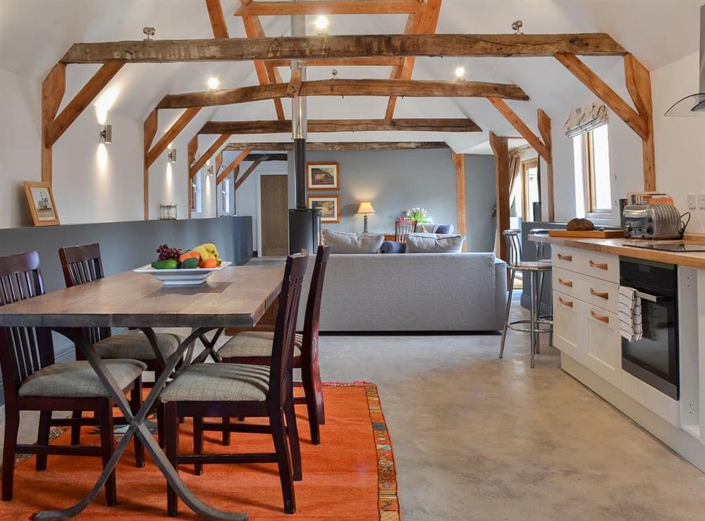 Dining area with exposed beams at Chiddock Cottage, 