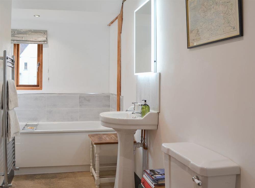 Lovely house bathroom with heated towel rail at Chiddock Cottage, 