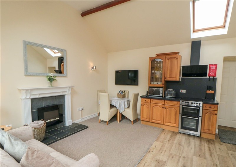 Relax in the living area at Midsummer Cottage, Thornton Dale