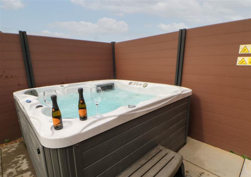 Relax in the hot tub at Mildreds Lodge, Felton