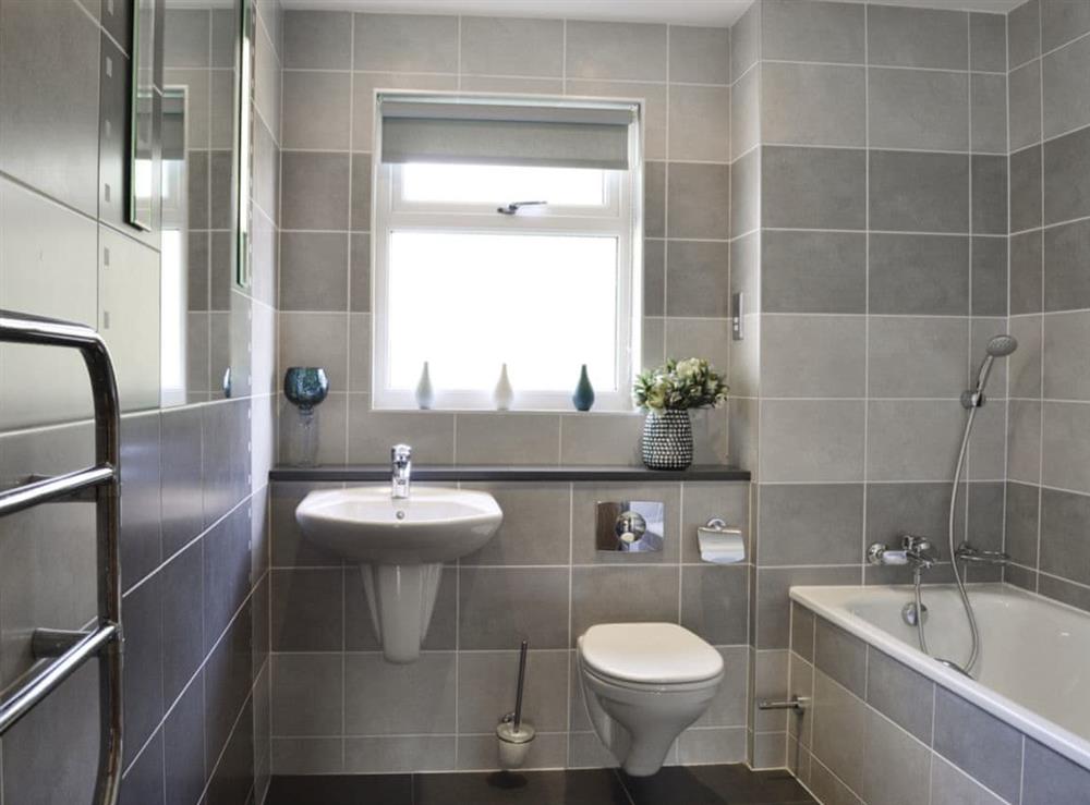 Bathroom with shower over bath and heated towel rail at 8 Military Drive, 