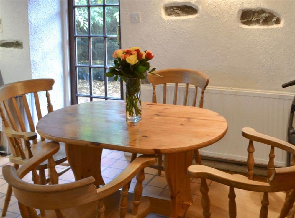 Quaint dining area at Mill Cottage in Buckfastleigh, near Dartmoor, Devon