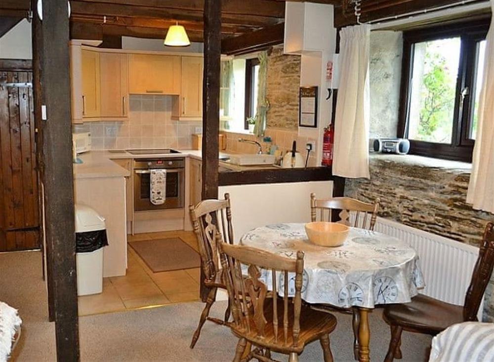 Dining area and well equipped kitchen at Mill Cottage in Fowey, Cornwall