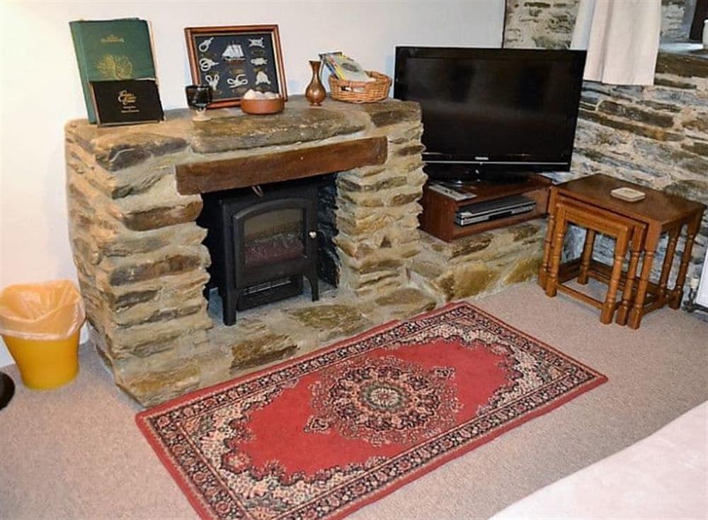 Relax in the cosy living area at Mill Cottage in Fowey, Cornwall