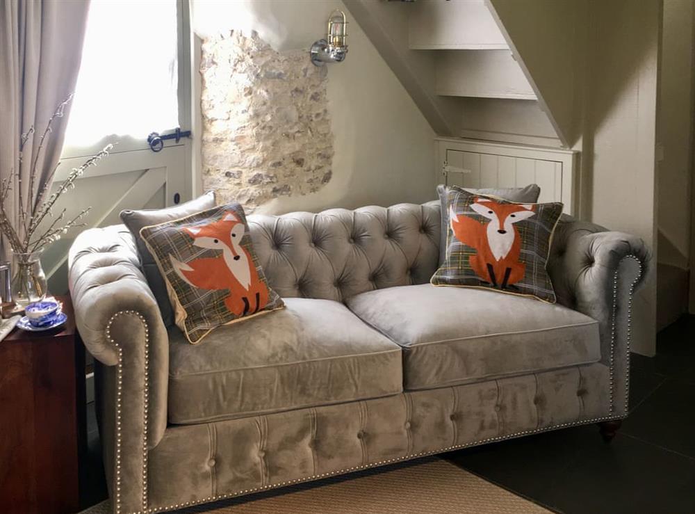 Comfy seating area at Mill Cottage in Hawkchurch, near Axminster, Devon