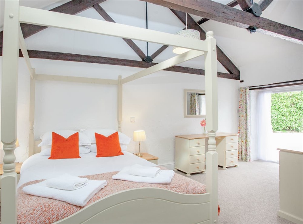 Four Poster bedroom at Mill Cottage in Marldon, near Paignton, Devon
