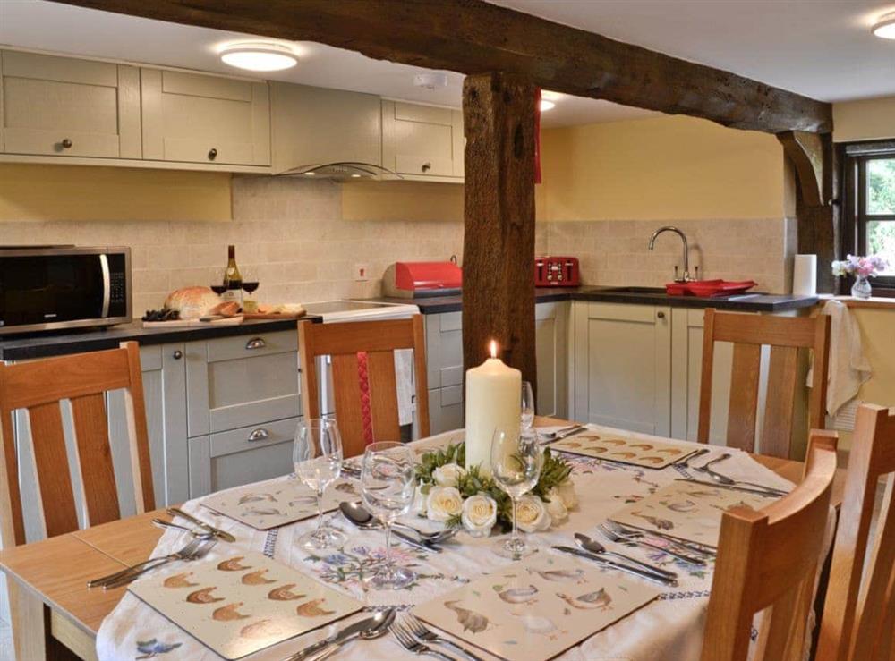 Dining area & kitchen at Mill Cottage in Peterchurch, near Hay-on-Wye, Herefordshire