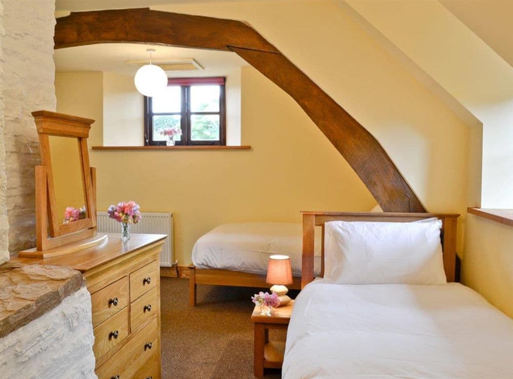 Twin bedroom with exposed wooden beams (photo 2) at Mill Cottage in Peterchurch, near Hay-on-Wye, Herefordshire