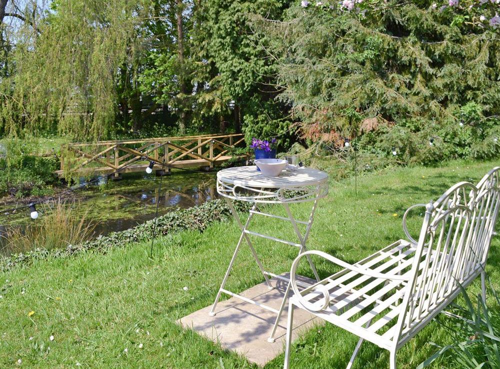 Sitting out area in garden at Mill Cottage in Stillington, near York, North Yorkshire