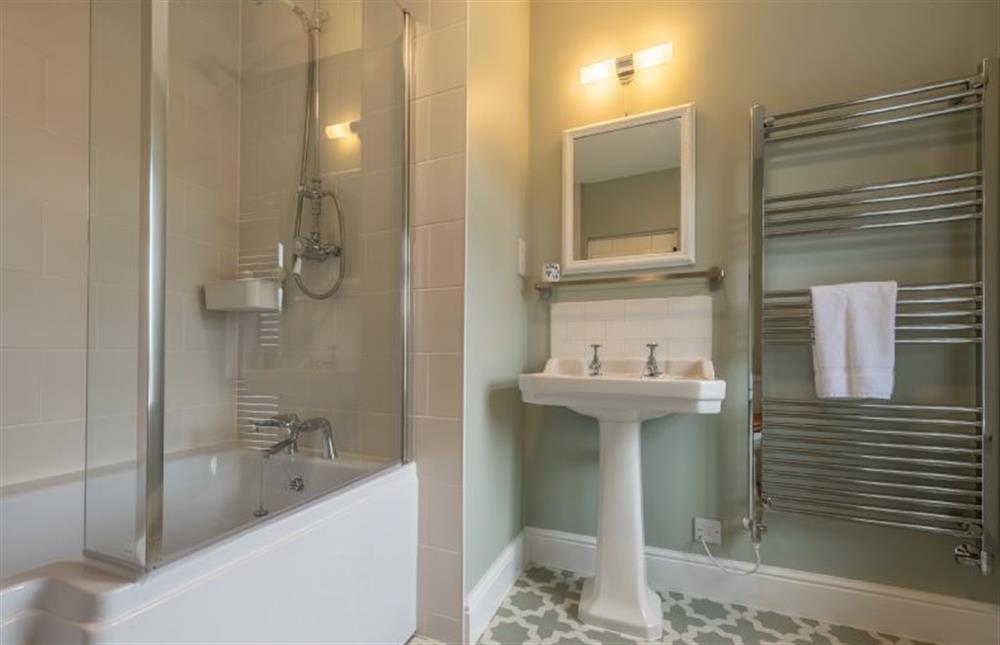 En-suite with bath with shower over