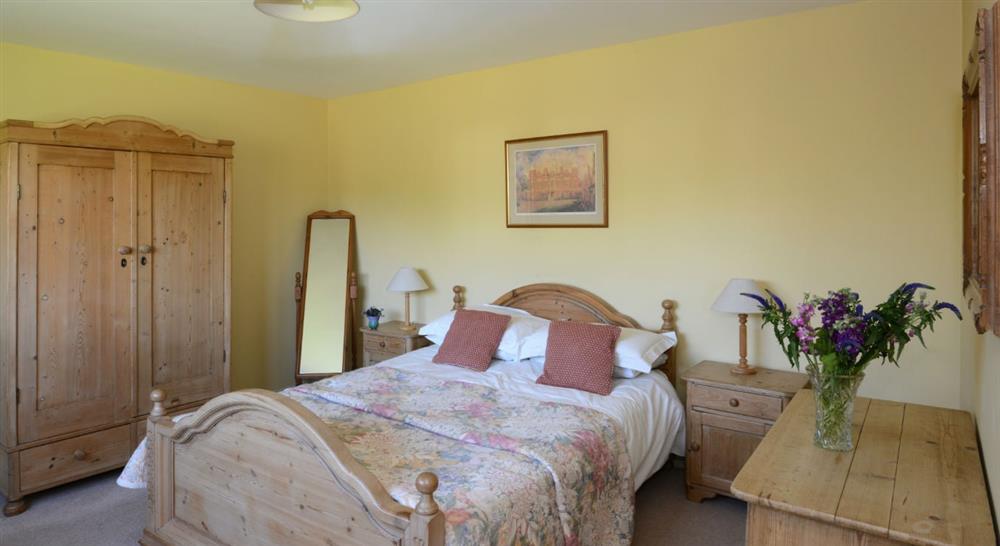 One of the large double bedrooms at Mill Farm Barn in Norwich, Norfolk