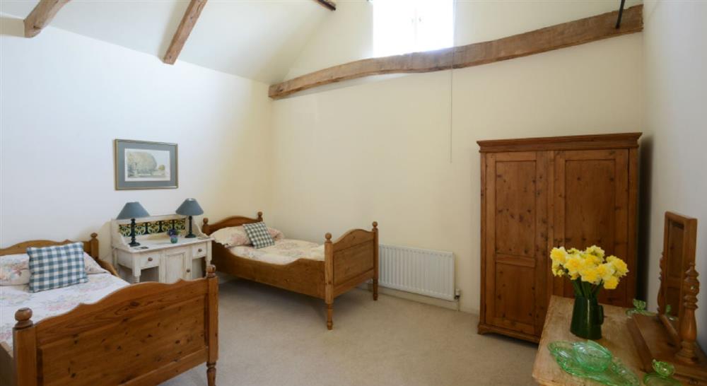 The light, airy twin bedroom at Mill Farm Barn in Norwich, Norfolk