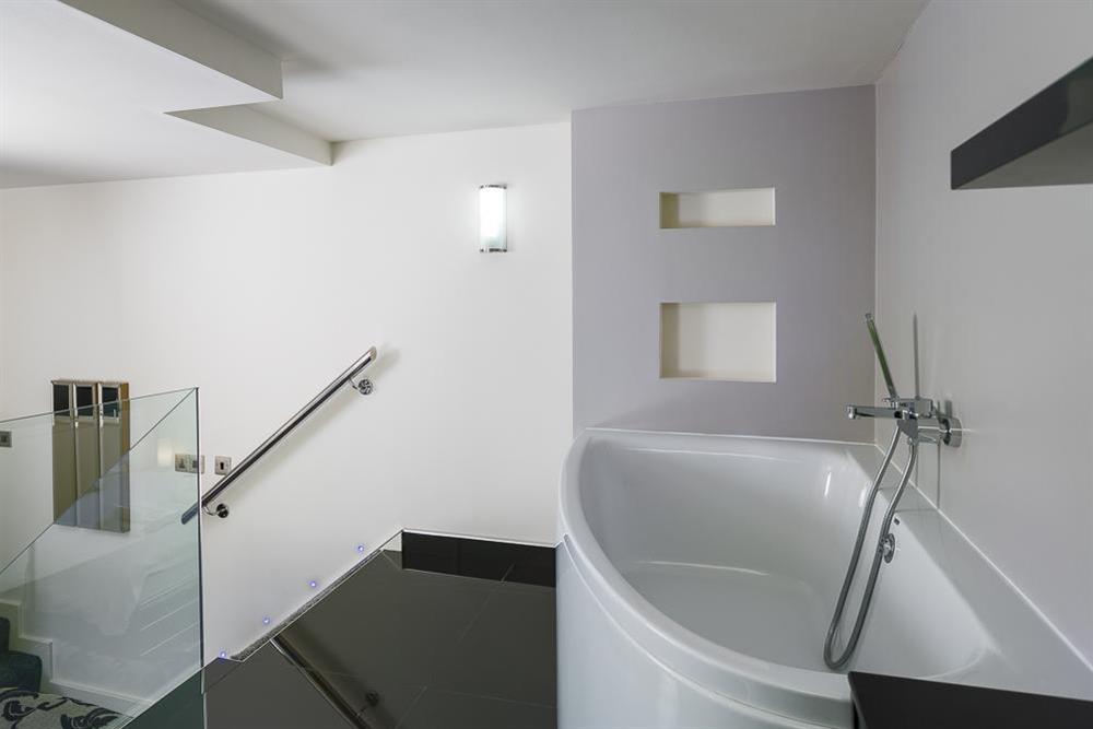 En suite bathroom with corner bath (photo 2) at Mill Grange in , Dartmouth