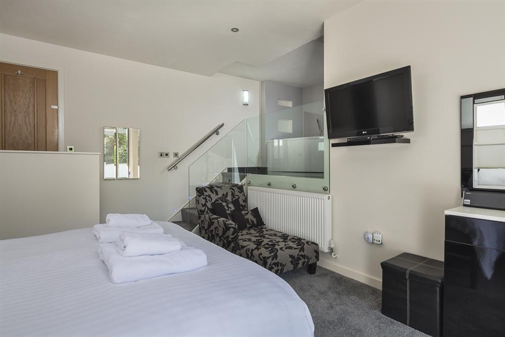Stairs lead up to the luxury open-plan en suite at Mill Grange in , Dartmouth
