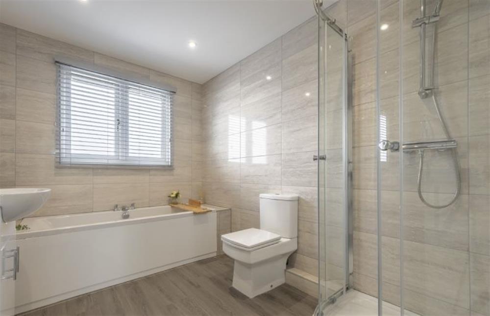 Bathroom with bath and shower cubicle at Mill Green House, Burnham Market near Kings Lynn