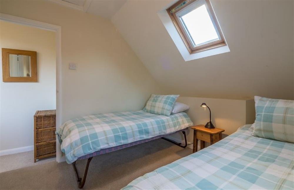 First floor: Bedroom two has a single bed and trundle bed (photo 2) at Mill House Cottage, Brancaster near Kings Lynn