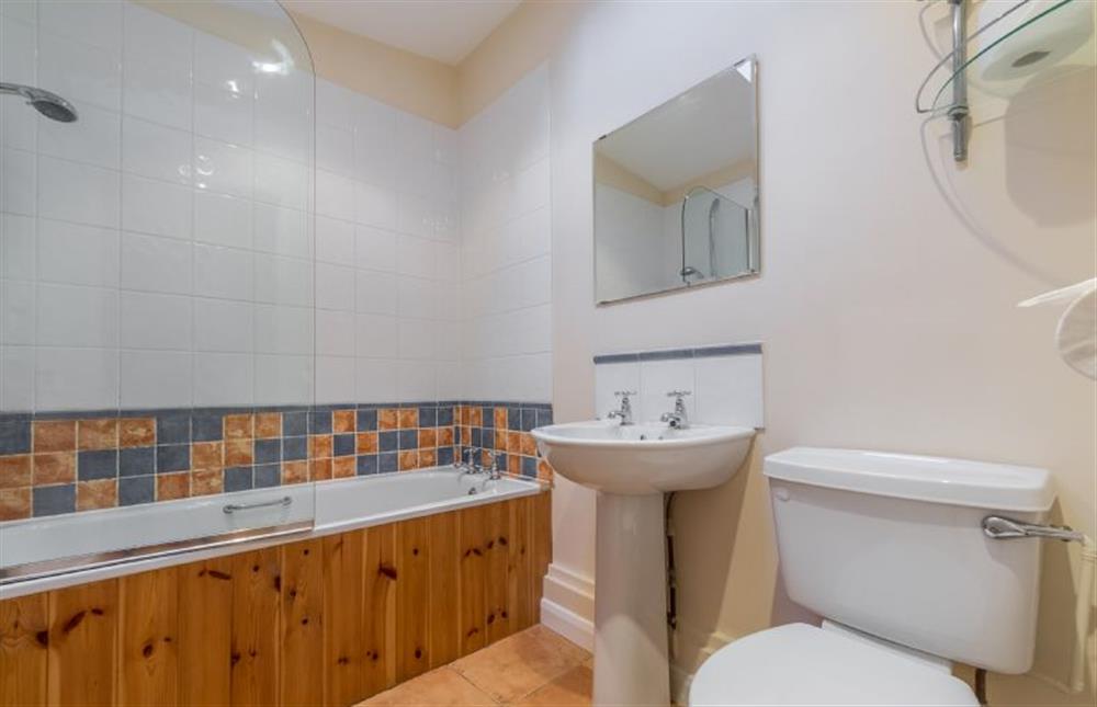 Ground floor: Bathroom with shower over at Mill House Cottage, Brancaster near Kings Lynn