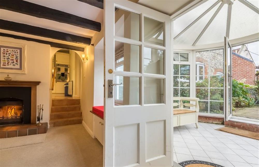 Ground floor: The conservatory and sitting room at Mill House Cottage, Brancaster near Kings Lynn