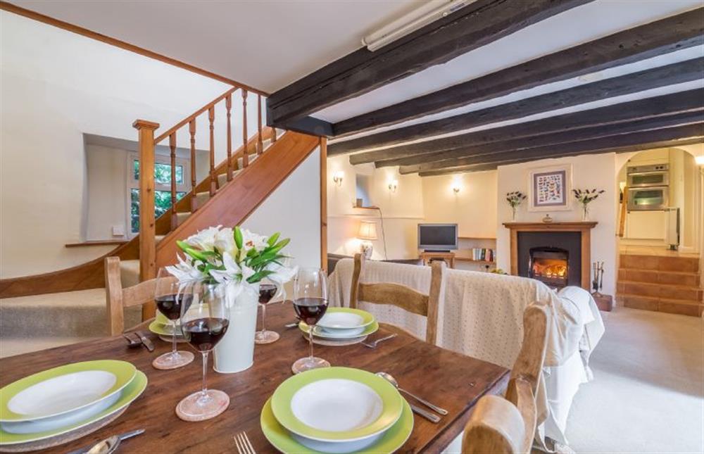 Ground floor: The dining area is at the back of the sitting room at Mill House Cottage, Brancaster near Kings Lynn