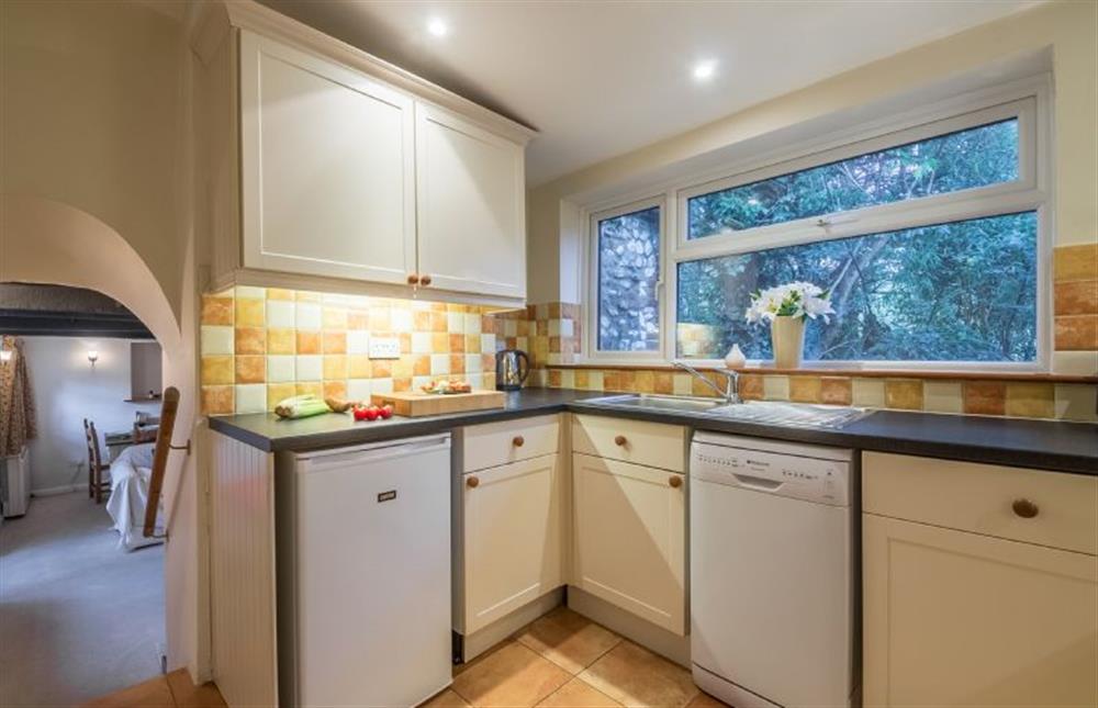Ground floor: The kitchen is up a few steps from the sitting room at Mill House Cottage, Brancaster near Kings Lynn