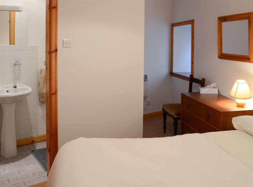 Double bedroom with en-suite shower room at Stable Cottage, 