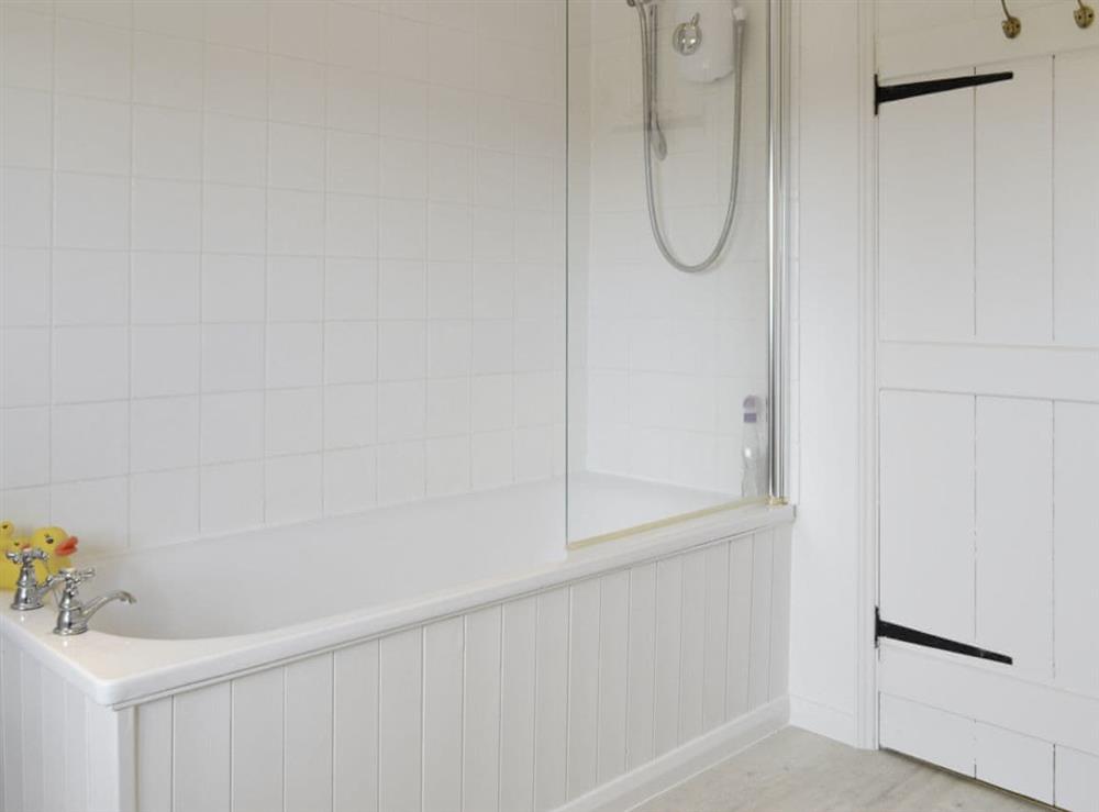 Family bathroom with shower over bath at Mill House in Docking, near Hunstanton, Norfolk